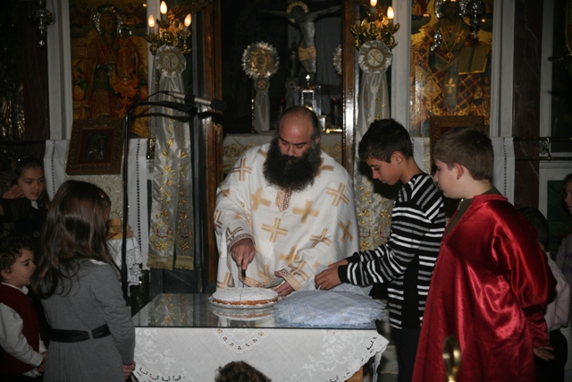 January 1 - St Basil's day - Slicing the 'Vassilopita' cake 